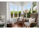 Bright sitting room with two armchairs and large windows at 4955 E Indian School Rd # 9, Phoenix, AZ 85018