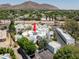 Aerial view showing complex and surrounding mountain views at 4955 E Indian School Rd # 9, Phoenix, AZ 85018