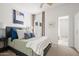 Bedroom with a comfortable bed and access to a bathroom at 4955 E Indian School Rd # 9, Phoenix, AZ 85018