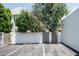 Private gated backyard with parking and landscaping at 4955 E Indian School Rd # 9, Phoenix, AZ 85018