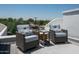 Relaxing rooftop patio furniture with city views at 4955 E Indian School Rd # 9, Phoenix, AZ 85018