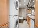 Bathroom with soaking tub, shower, and laundry at 4955 E Indian School Rd # 9, Phoenix, AZ 85018