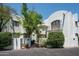 Charming stucco building with courtyard entry and landscaping at 4955 E Indian School Rd # 9, Phoenix, AZ 85018