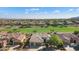 Aerial view of house with solar panels and golf course at 20447 N 266Th Ave, Buckeye, AZ 85396