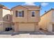 Tan two-story house with attached garage at 4310 E Jasper Dr, Gilbert, AZ 85296