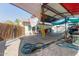 Covered carport with shade and car-washing setup at 2445 W Yuma St, Phoenix, AZ 85009