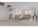 Spacious bonus room with sectional sofa and large windows at 2377 S 245Th Dr, Buckeye, AZ 85326