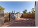 Backyard with block wall, wooden fence, and gate at 3646 N 69Th Ave # 60, Phoenix, AZ 85033