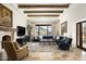 Spacious living room with fireplace, large windows, and mountain views at 10493 E Rimrock Dr, Scottsdale, AZ 85255