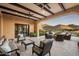 Covered patio with seating area and mountain views at 10493 E Rimrock Dr, Scottsdale, AZ 85255