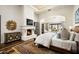 Spacious main bedroom with fireplace and sitting area, offering comfort and luxury at 10493 E Rimrock Dr, Scottsdale, AZ 85255