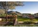 Landscaped backyard with mountain views and a pergola at 10493 E Rimrock Dr, Scottsdale, AZ 85255