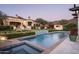 Resort-style pool and spa with a hot tub and mountain backdrop at 10493 E Rimrock Dr, Scottsdale, AZ 85255