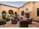 Inviting courtyard with fireplace and comfortable seating at 10493 E Rimrock Dr, Scottsdale, AZ 85255
