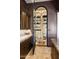 Walk-in wine cellar with ample storage and ladder at 10493 E Rimrock Dr, Scottsdale, AZ 85255