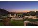 Serene backyard oasis with pergola, fire pit, and expansive lawn at 10493 E Rimrock Dr, Scottsdale, AZ 85255
