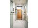 Modern bathroom with a walk-in shower and access to private outdoor patio at 10493 E Rimrock Dr, Scottsdale, AZ 85255
