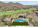 Resort-style pool and expansive backyard with mountain views at 10493 E Rimrock Dr, Scottsdale, AZ 85255
