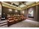 Luxury home theater with brown leather recliner seating at 10493 E Rimrock Dr, Scottsdale, AZ 85255