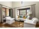 Bright living room with comfortable seating and access to backyard at 10493 E Rimrock Dr, Scottsdale, AZ 85255