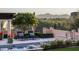 Relaxing poolside patio with lounge chairs and stunning mountain backdrop at 10493 E Rimrock Dr, Scottsdale, AZ 85255