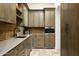 Butler's pantry with ample counter and cabinet space at 10493 E Rimrock Dr, Scottsdale, AZ 85255