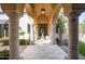 Elegant entryway with arched walkway leading to the front door at 10493 E Rimrock Dr, Scottsdale, AZ 85255