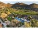 Inviting pool and spa with pergola and lush landscaping at 10493 E Rimrock Dr, Scottsdale, AZ 85255