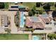 Aerial view of a home with solar panels, pool, and stables at 7113 N 183Rd Ave, Waddell, AZ 85355