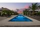 Long rectangular pool at sunset, view from house at 7113 N 183Rd Ave, Waddell, AZ 85355