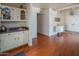 Small kitchen with white cabinets and a wood-look floor at 1736 N Ashbrook Cir, Mesa, AZ 85213