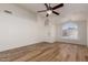 Living room with hardwood floors, large window, and ceiling fan at 19433 N 7Th Dr, Phoenix, AZ 85027