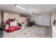 Attached garage with ample space for storage and a workbench at 6827 S Sunrise Way, Buckeye, AZ 85326