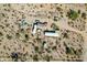 Aerial view showing a mobile home and several outbuildings on a desert lot at 30150 N Bryce Trl, San Tan Valley, AZ 85144