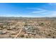 Aerial view of a desert property with a large house and surrounding desert landscape at 30150 N Bryce Trl, San Tan Valley, AZ 85144