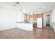 Kitchen with wood cabinets, tile floor, and island at 7300 N 51St Ave # D212, Glendale, AZ 85301