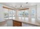 Kitchen features breakfast bar and view to backyard at 7300 N 51St Ave # D212, Glendale, AZ 85301