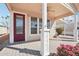Covered porch with red door and ceiling fan at 7300 N 51St Ave # D212, Glendale, AZ 85301