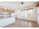 Kitchen with wood cabinets, tile floor, and island at 7300 N 51St Ave # D212, Glendale, AZ 85301