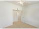 Bright bedroom with ceiling fan and access to hallway at 2402 E 5Th St # 1429, Tempe, AZ 85288