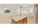 Open concept kitchen with island and tile flooring at 2402 E 5Th St # 1429, Tempe, AZ 85288