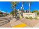 Villagio 2402 community entrance with palm trees and walkway at 2402 E 5Th St # 1429, Tempe, AZ 85288