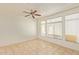 Spacious living room featuring large windows and tile floors at 2402 E 5Th St # 1429, Tempe, AZ 85288