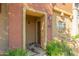 Condo entrance with a brown door and desert landscaping at 2402 E 5Th St # 1429, Tempe, AZ 85288