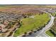 Aerial view of community with green spaces at 38125 W Excussare Way, Maricopa, AZ 85138