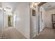 Long hallway with access to other rooms and entryway at 11110 N 165Th Ave, Surprise, AZ 85388