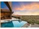 Stunning infinity pool with mountain and city views at 36700 N Lone Eagle Pt, Carefree, AZ 85377