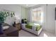 Bright bedroom with green accents and a comfortable bed at 18156 W Cielo Grande Ave, Surprise, AZ 85387