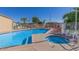 Community pool and spa with lounge chairs at 2460 E Main St # A17, Mesa, AZ 85213