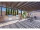 Outdoor kitchen and picnic tables under pergola at 2460 E Main St # A17, Mesa, AZ 85213